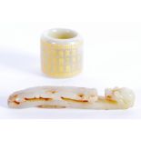 A CHINESE CARVED JADE CALLIGRAPHY ARCHERS RING together with a dragon belt hook. Largest 6 cm long.
