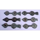 A SET OF SIX MIDDLE EASTERN SALJUK BRONZE DOOR HINGES possibly 10th/12th century. 17 cm long. (6)