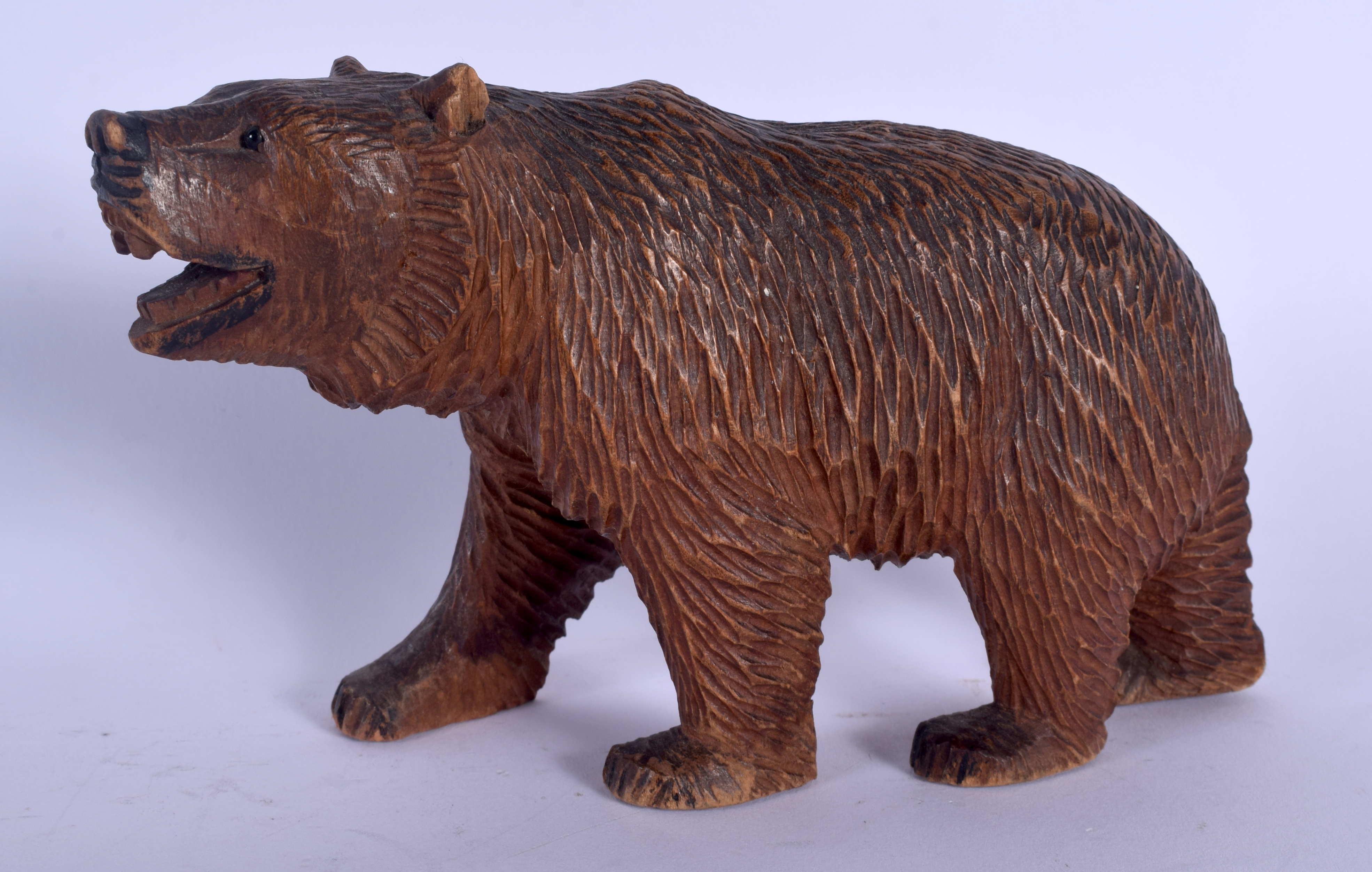 A BAVARIAN BLACK FOREST CARVED WOOD FIGURE OF A BEAR. 14 cm x 11 cm.