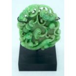 A Chinese carved Jade boulder on a stand 9 x 8cm.