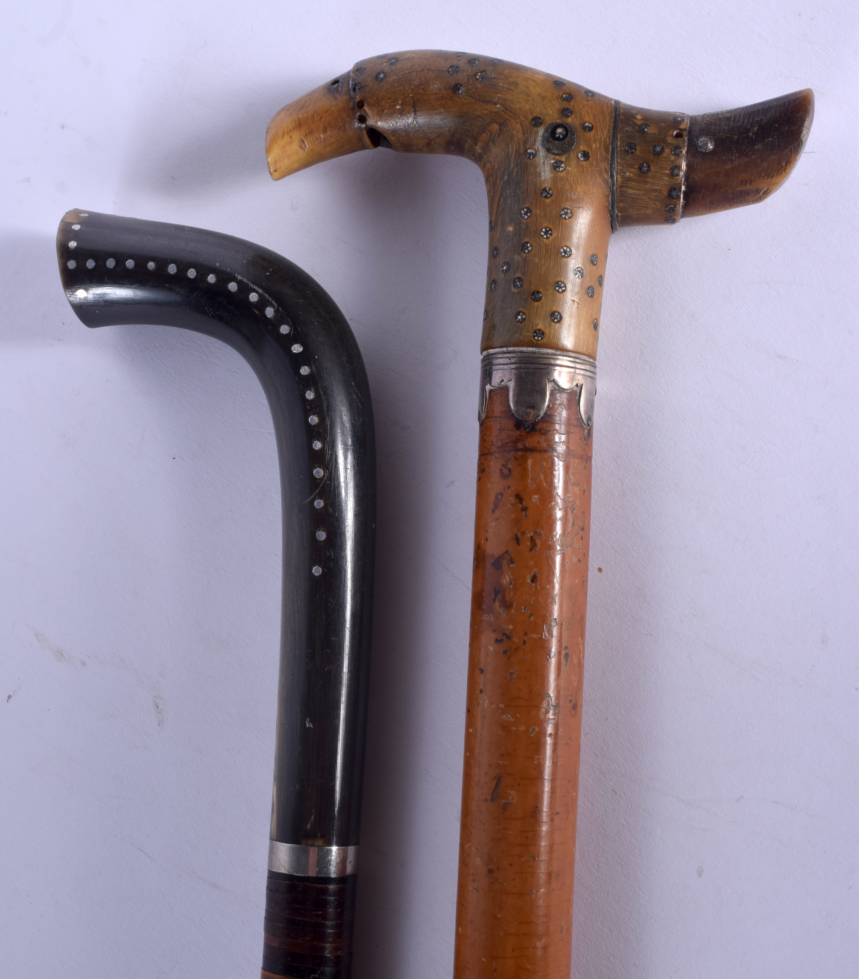 TWO 19TH CENTURY CONTINENTAL CARVED RHINOCEROS HORN HANDLED WALKING CANES with silver pique work han - Image 2 of 6