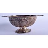 A 19TH CENTURY EUROPEAN TWIN HANDLED SILVER PORRINGER decorated with foliage and vines. 255 grams 23