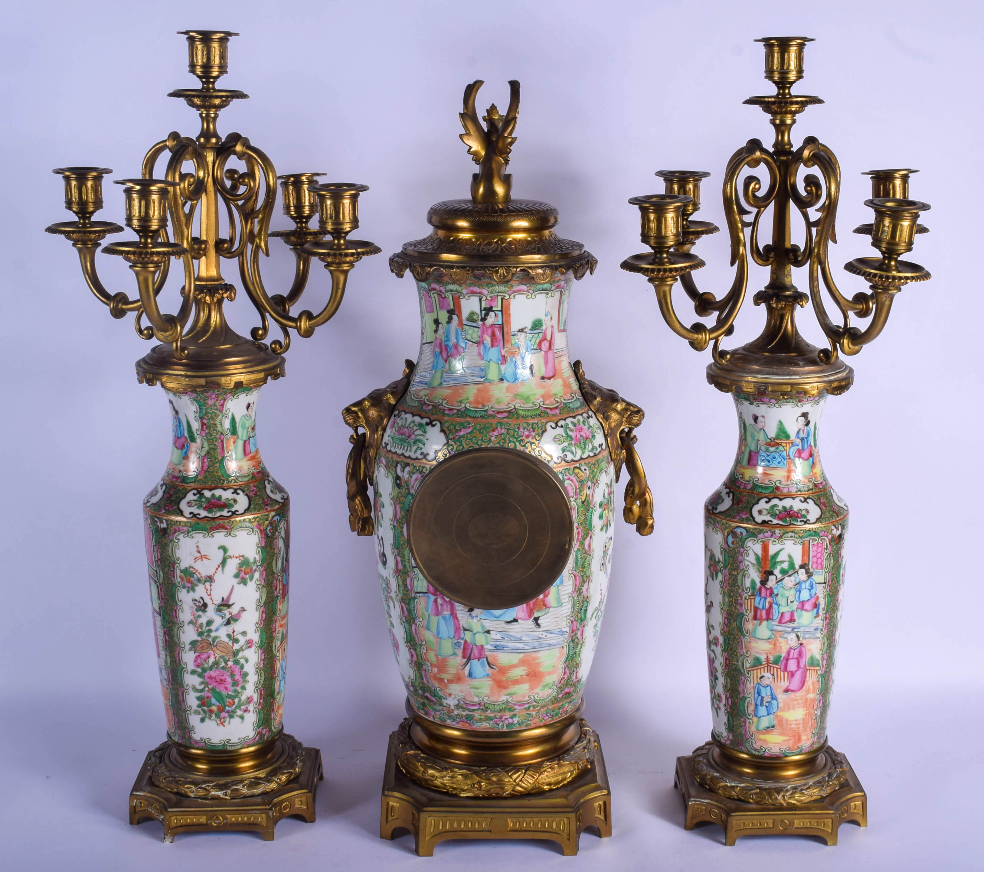 A RARE 19TH CENTURY CHINESE CANTON FAMILLE ROSE CLOCK GARNITURE Qing, painted with figures in variou - Bild 2 aus 2