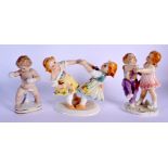 TWO KARL ENZ VOLKSTEDT PORCELAIN FIGURAL GROUPS together with another similar. Largest 14 cm x 14 cm