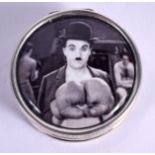 A CONTEMPORARY SILVER CHARLIE CHAPLIN BOX. 17 grams. 3 cm diameter.