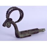 A MIDDLE EASTERN LORISTAN BRONZE FINIAL in the form of an ibex. 17 cm x 11 cm.