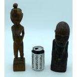 A carved wooden African kneeling fertility figure and another figure . 33 cm (2).