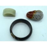 An Agate bracelet together with a carved hardstone pendant and a piece of carved jade 7cm (3)