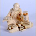 A 19TH CENTURY JAPANESE MEIJI PERIOD CARVED IVORY OKIMONO modelled as an artisan. 8 cm x 7 cm.