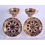 Royal Crown Derby imari pattern 1128 two pedestal cups and saucers. Cup 5.5cm high, Saucer 14cm w