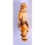 A LOVELY 18TH CENTURY JAPANESE MEIJI PERIOD CARVED IVORY NETSUKE modelled as a scowling male. 5 cm x