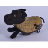 A WIND UP SCHUCO TIN PLATE DOG. 12 cm wide.