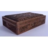 AN EARLY 20TH CENTURY KASHMIR INDIAN CARVED SANDALWOOD BOX AND COVER decorated with foliage and vine