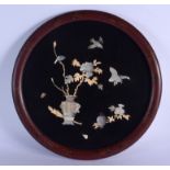 A 19TH CENTURY JAPANESE MEIJI PERIOD BLACK LACQUER SHIBAYAMA PLAQUE decorated with birds amongst fol