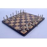 AN ANTIQUE INDIAN RUBY INSET CHESS SET with board. Largest piece 5.25 cm high. (qty)