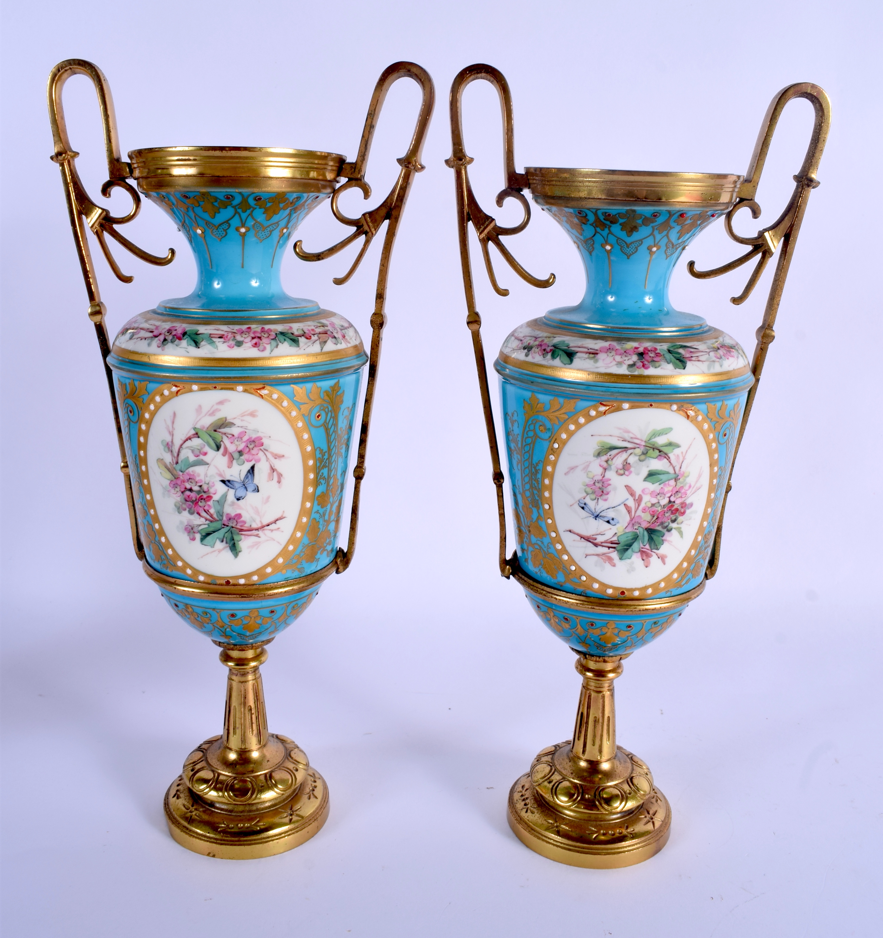 A PAIR OF 19TH CENTURY FRENCH SEVRES PORCELAIN VASES painted and jewelled with putti in various purs - Image 2 of 2