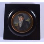 English School (19th Century) Bone miniature, handsome male in blue. Image 6.5 cm wide.