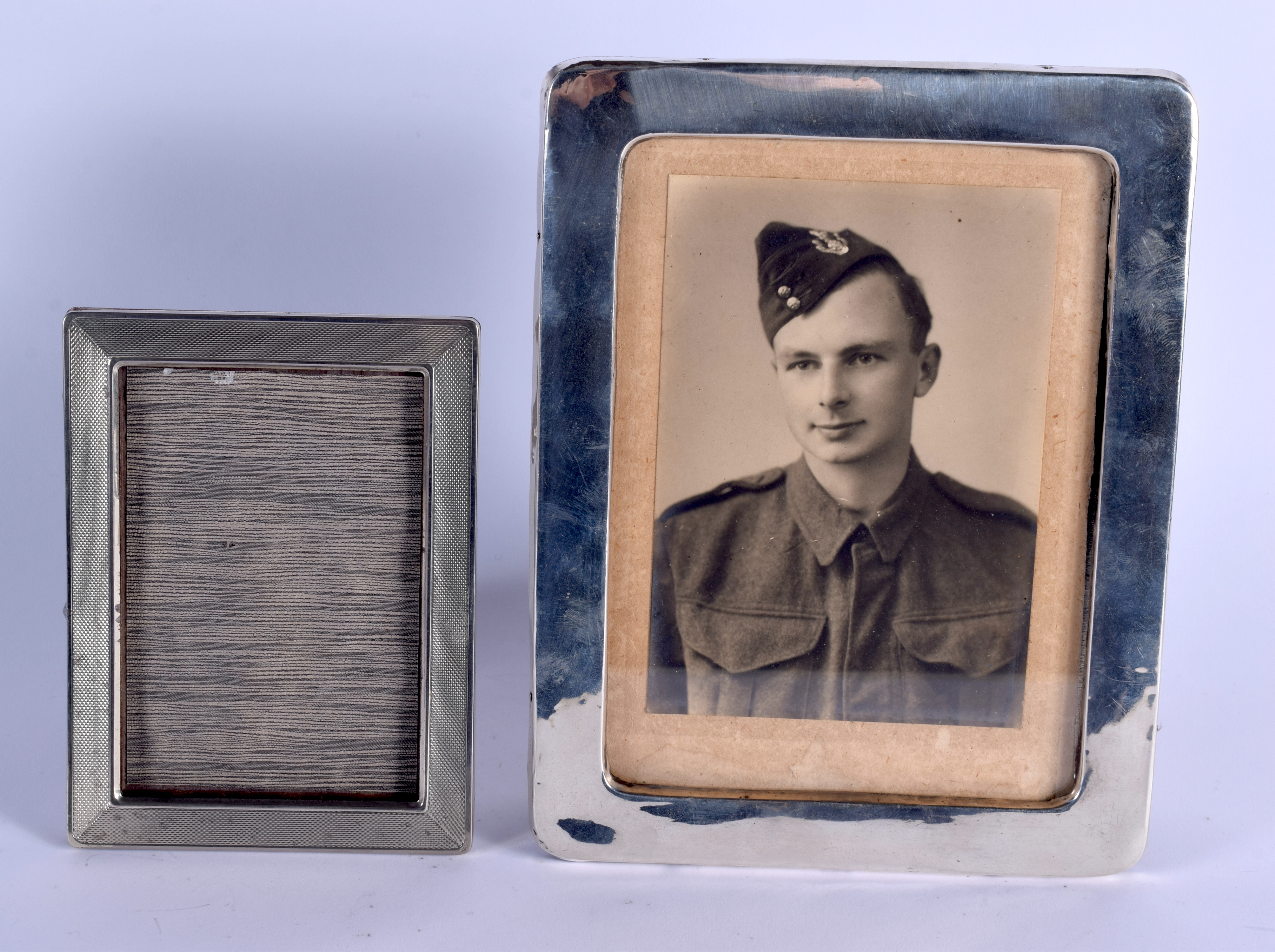 TWO SILVER PHOTOGRAPH FRAMES. 400 grams overall. Largest 22 cm x 17 cm. (2)