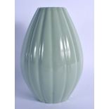 A CHINESE CELADON RIBBED VASE 20th Century, bearing Qianlong marks to base. 24 cm high.