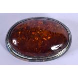 A SILVER AND AMBER BROOCH. 4.5 cm x 3 cm.