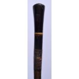 A RARE 19TH CENTURY MIDDLE EASTERN INDIAN CARVED FULL LENGTH RHINOCEROS HORN CANE of tapering form.