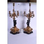 A PAIR OF 19TH CENTURY FRENCH BRONZE AND ORMOLU CANDLEABRA decorated with putti. 53 cm x 15 cm not i