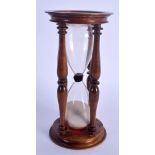 AN ANTIQUE MAHOGANY TREEN SAND TIMER. 16.5 cm high.