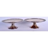 A PAIR OF TIFFANY & CO STERLING SILVER PEDESTAL TAZZA. 1054 grams. 24 cm x 5 cm.