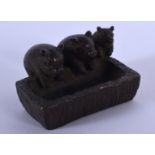 A JAPANESE BRONZE PIG TROUGH OKIMONO. 4 cm x 3 cm.