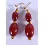 A PAIR OF ART DECO CHERRY AMBER BAKELITE EARRINGS. 5 grams. 4 cm long.