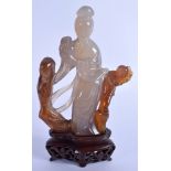 AN EARLY 20TH CENTURY CHINESE CARVED AGATE FIGURE OF A FEMALE Late Qing, modelled beside a peering c