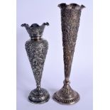 TWO EARLY 20TH CENTURY INDIAN WHITE METAL VASES. 823 grams (one weighted). Largest 25 cm high. (2)