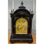 A LARGE ANTIQUE EBONISED MANTEL CLOCK by Nathan & Co, overlaid with foliage and vines. 70 cm x 35 cm