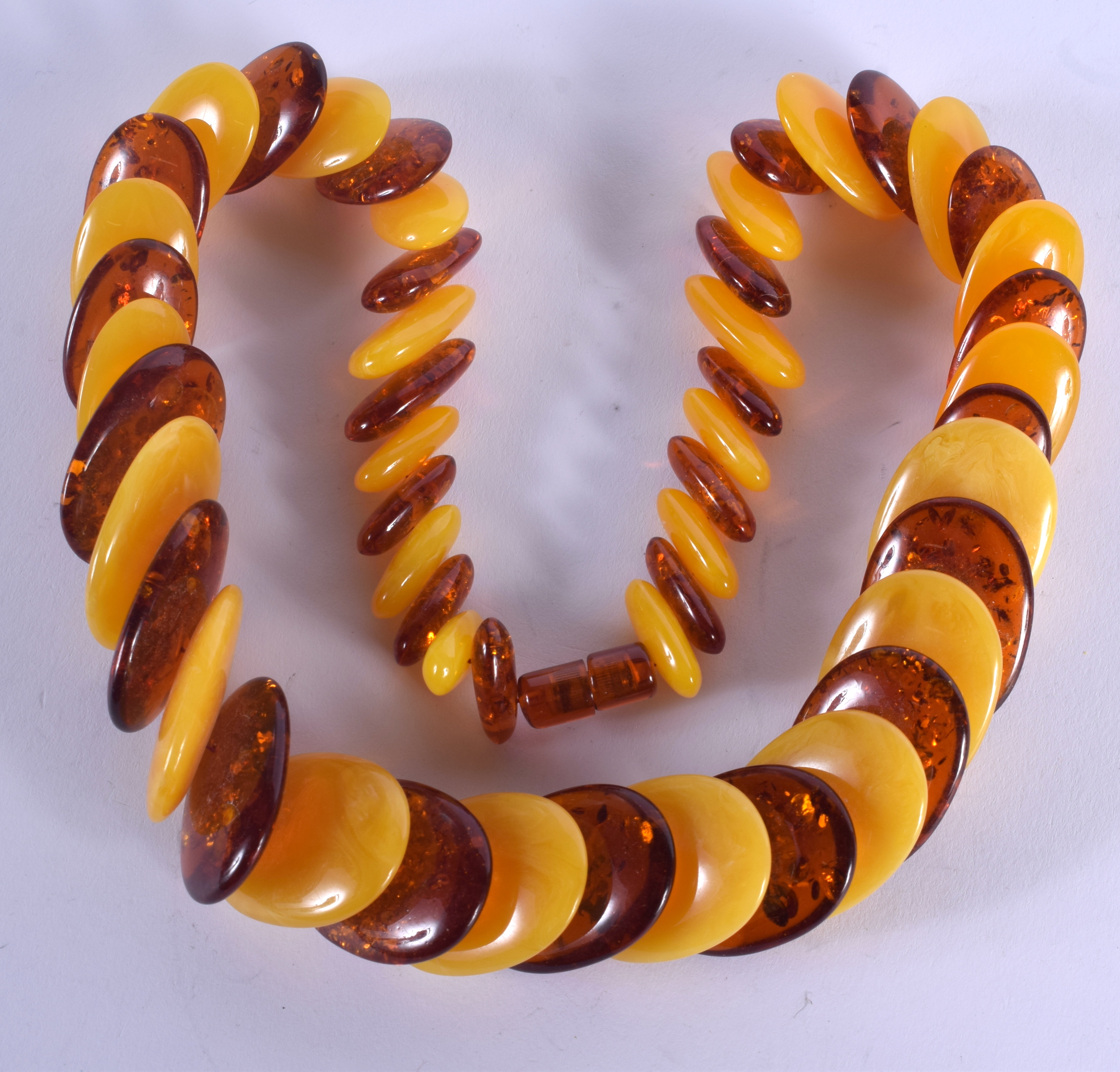 AN AMBER NECKLACE. 132 grams. 54 cm long.