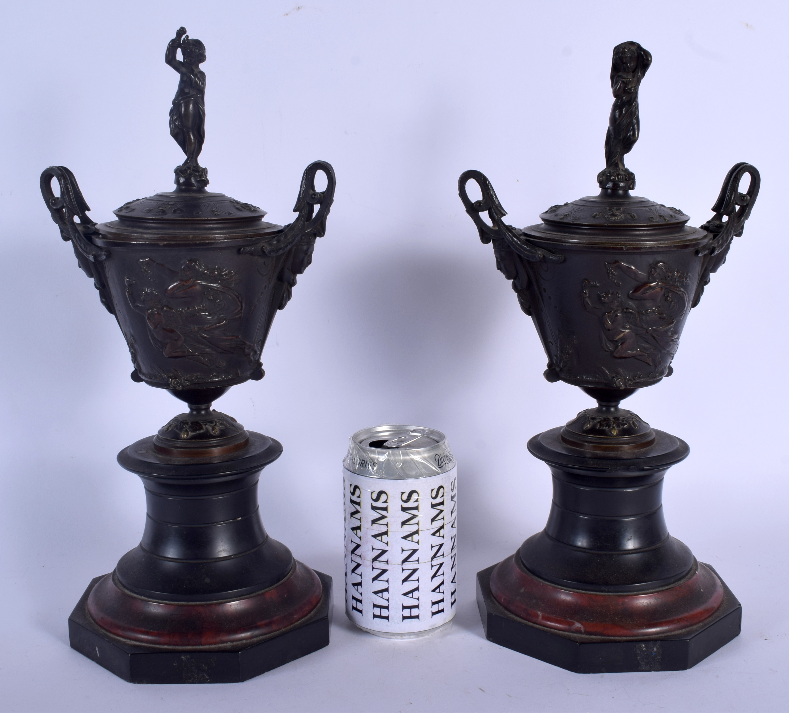 A PAIR OF 19TH CENTURY EUROPEAN GRAND TOUR BRONZES AND COVERS upon red and black marble bases. 34 cm