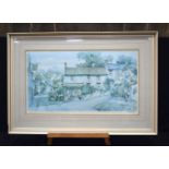 A large framed print by Sturgeon of a village scene 45 x 79cm.