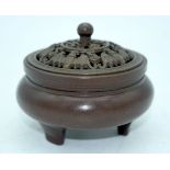 A small Chinese bronze lidded censer 9 x 7 cm.