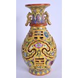 A CHINESE TWIN HANDLED FAMILLE ROSE RETICULATED VASE 20th Century, painted with floral sprays. 23 cm