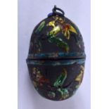 AN EARLY 20TH CENTURY CHINESE SILVER AND ENAMEL EGG LOCKET. 3.5 cm high.