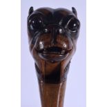 A PAIR OF 19TH CENTURY SWISS DOG HEAD NUT CRACKERS modelled with glass eyes. 19 cm long.