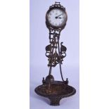 A CONTEMPORARY MYSTERY CLOCK. 26 cm high inc pendulum.