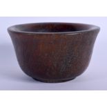 A CHINESE CARVED BUFFALO HORN TYPE CIRCULAR LIBATION CUP 20th Century. 212 grams. 8.5 cm diameter.