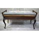 A mahogany upholstered lifting top stool 96 x 40 x 53cm .