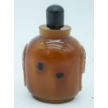 An carved agate snuff bottle with stopper 9cm.