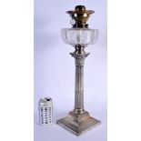 AN EDWARDIAN SILVER CORINTHIAN CANDLESTICK OIL LAMP. Sheffield 1904. 3.8kgs overall. 52 cm x 15 cm.