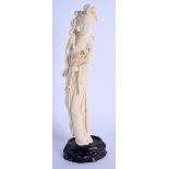 A LARGE LATE 19TH CENTURY CHINESE CARVED BONE FIGURE OF AN IMMORTAL Qing, modelled holding a floral