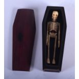 A BONE AND HARDWOOD COFFIN. 12 cm x 3 cm.