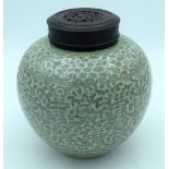 A Chinese Celadon glazed ginger jar with a hardwood cover 24cm (2)