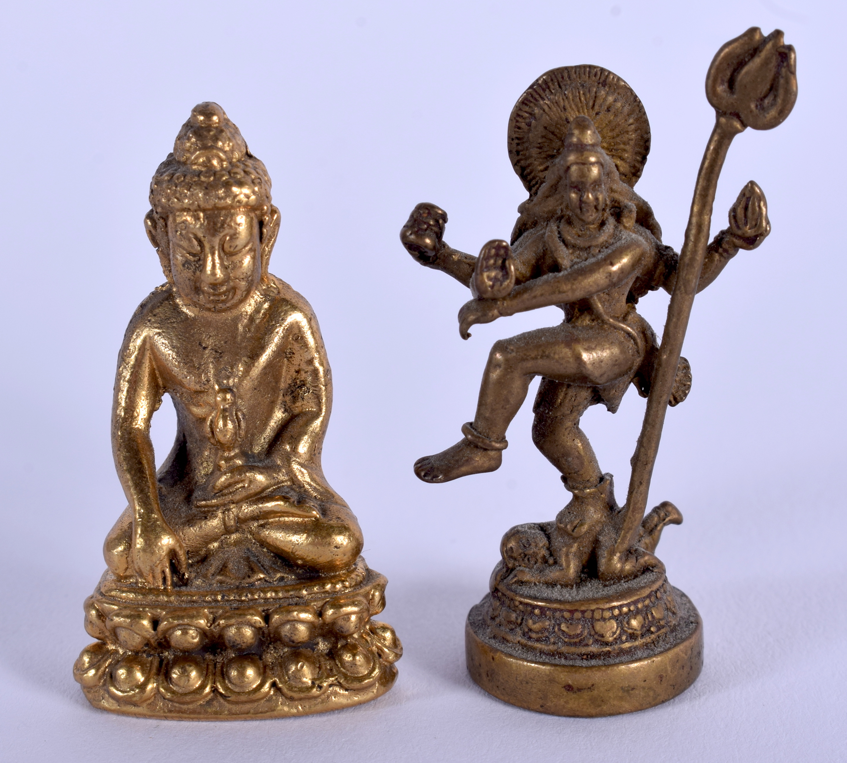 AN EARLY 20TH CENTURY SINO TIBETAN BRONZE BUDDHA together with another similar. Largest 3.5 cm high.