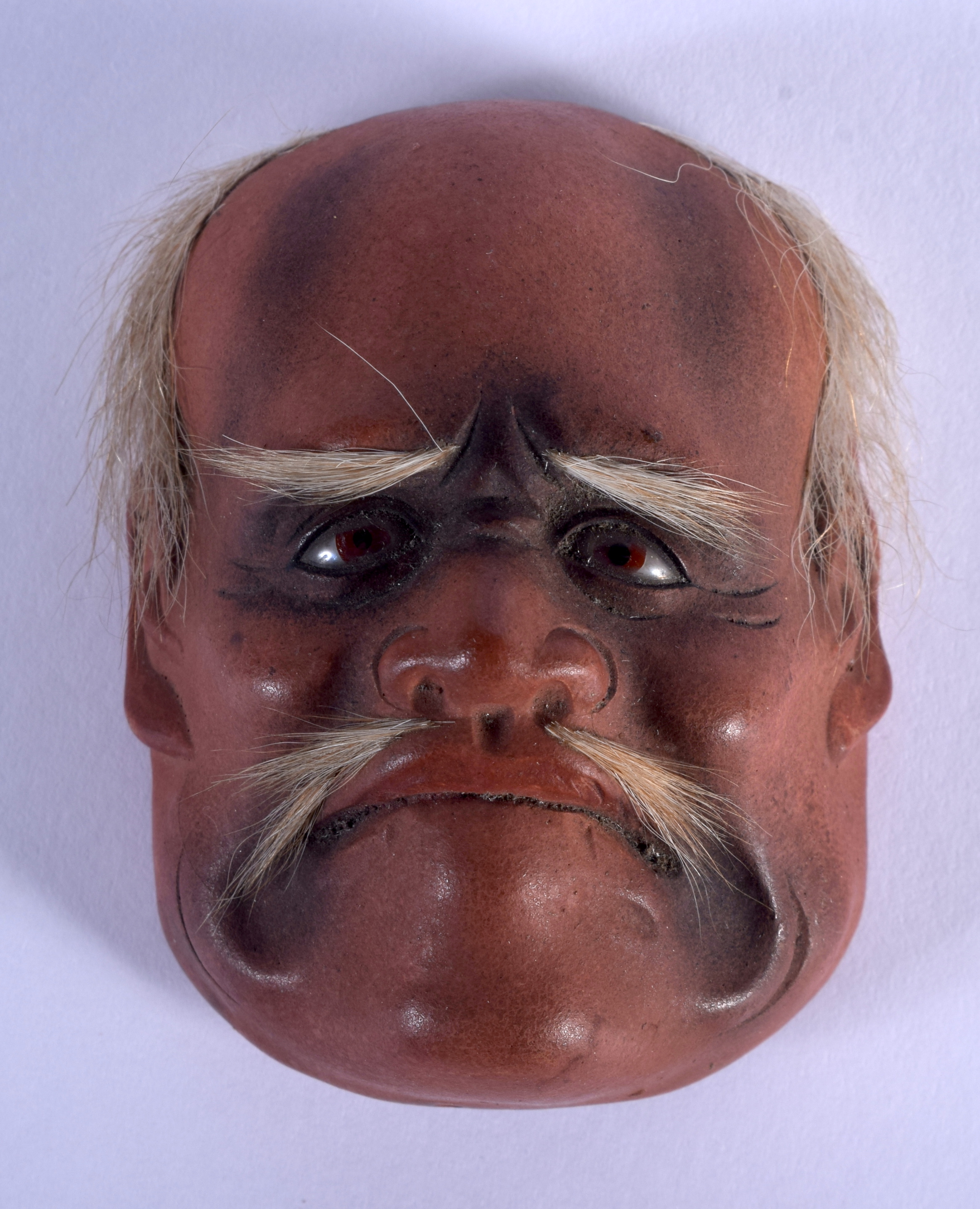 A 19TH CENTURY JAPANESE MEIJI PERIOD NOH MASK. 5 cm x 4 cm.